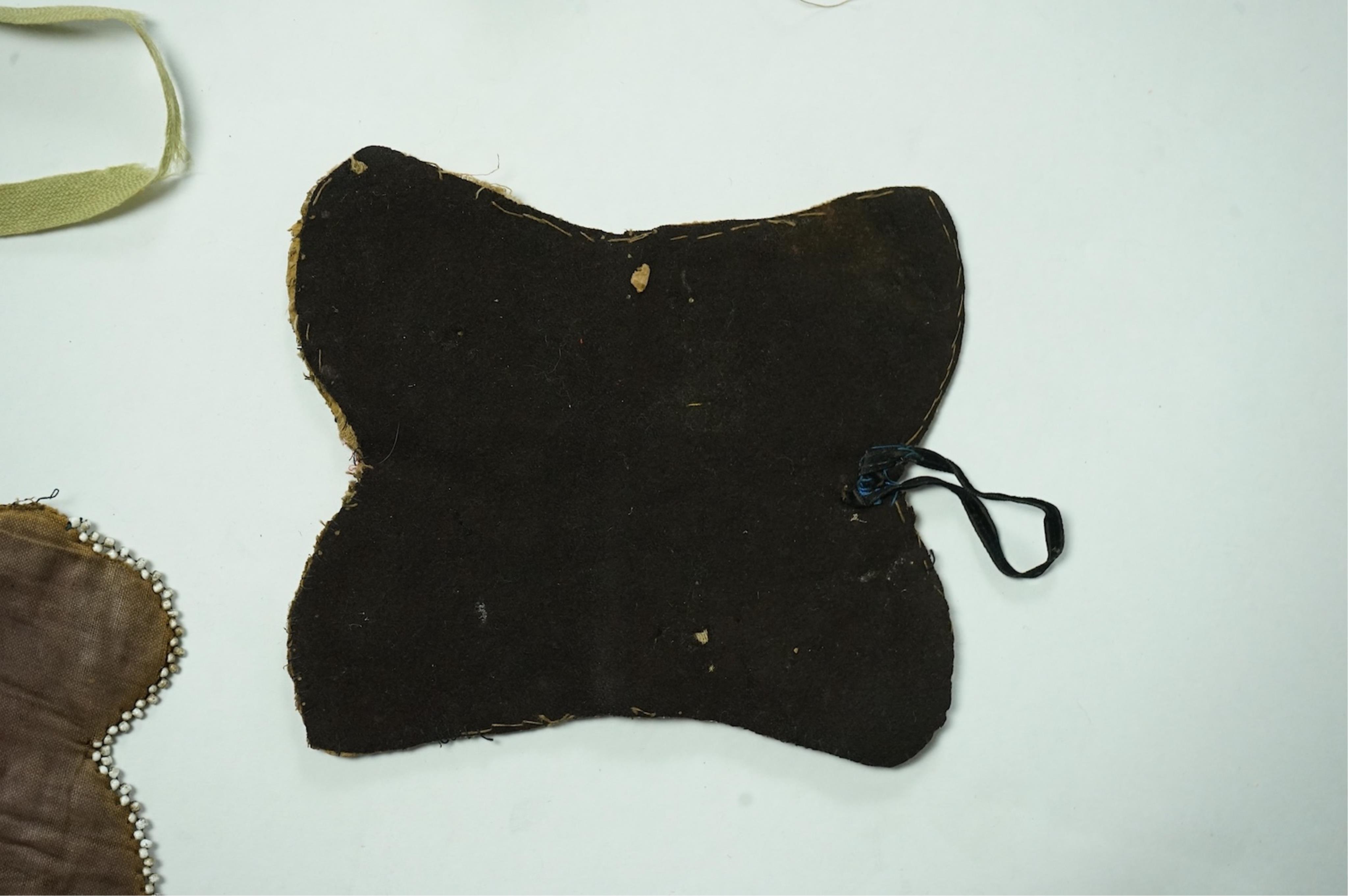 Five 19th century Native American beaded bags. Including a red felt coin pouch, three varying sized bags and a beaded panel.(5) Condition - four have damage to the fringing and beading and backing cloth. The light bag th